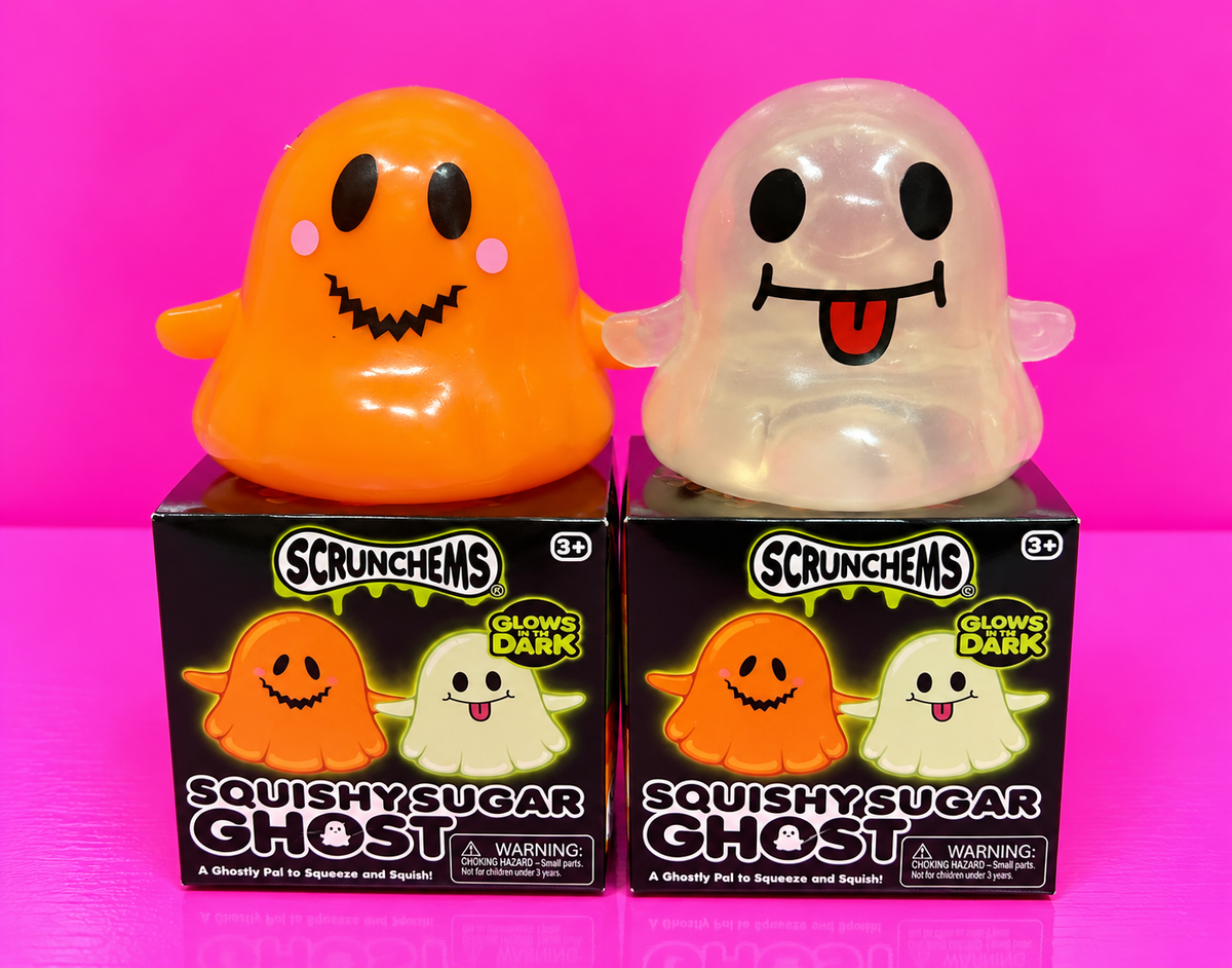 Orange and clear Scrunchems glow in the dark ghosts on pink background
